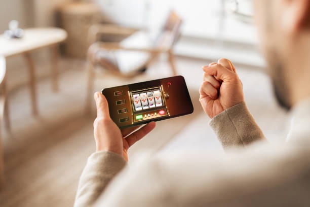 asdtoto mobile app interface showing casino games and sportsbook betting options